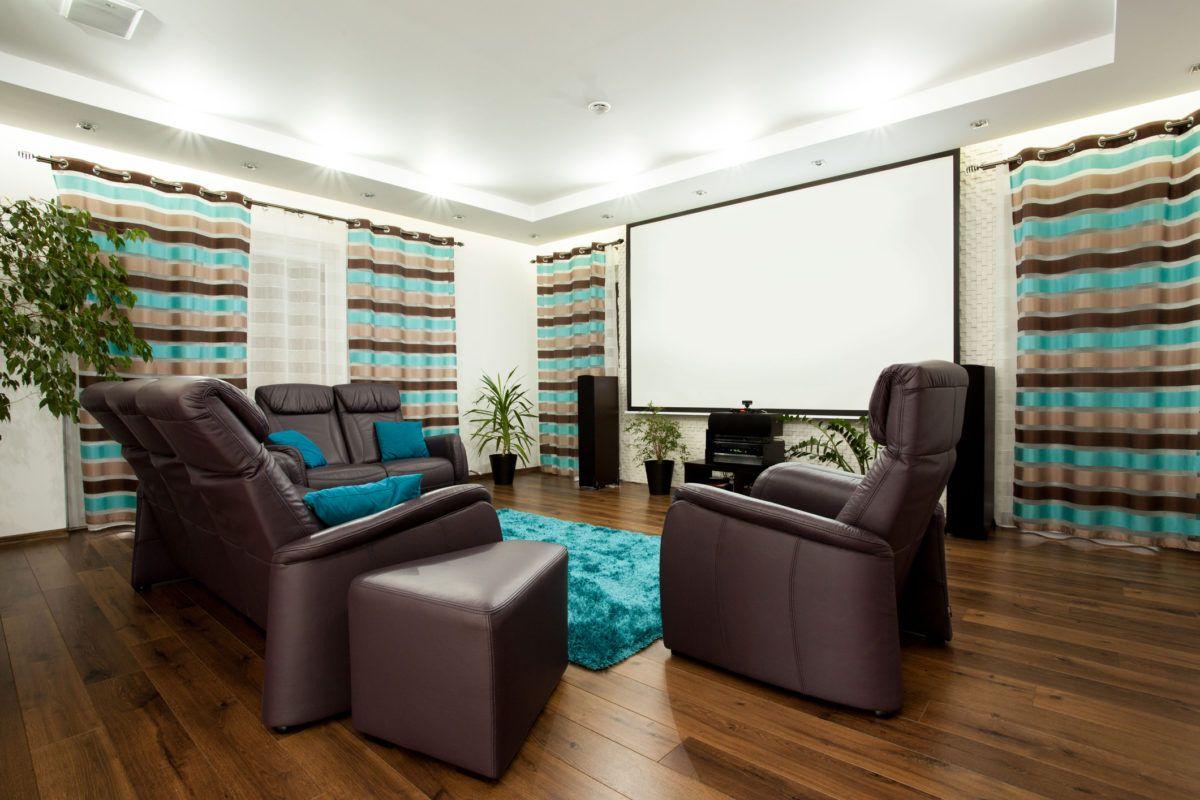 home theater setup with projector screen leather seats curtains